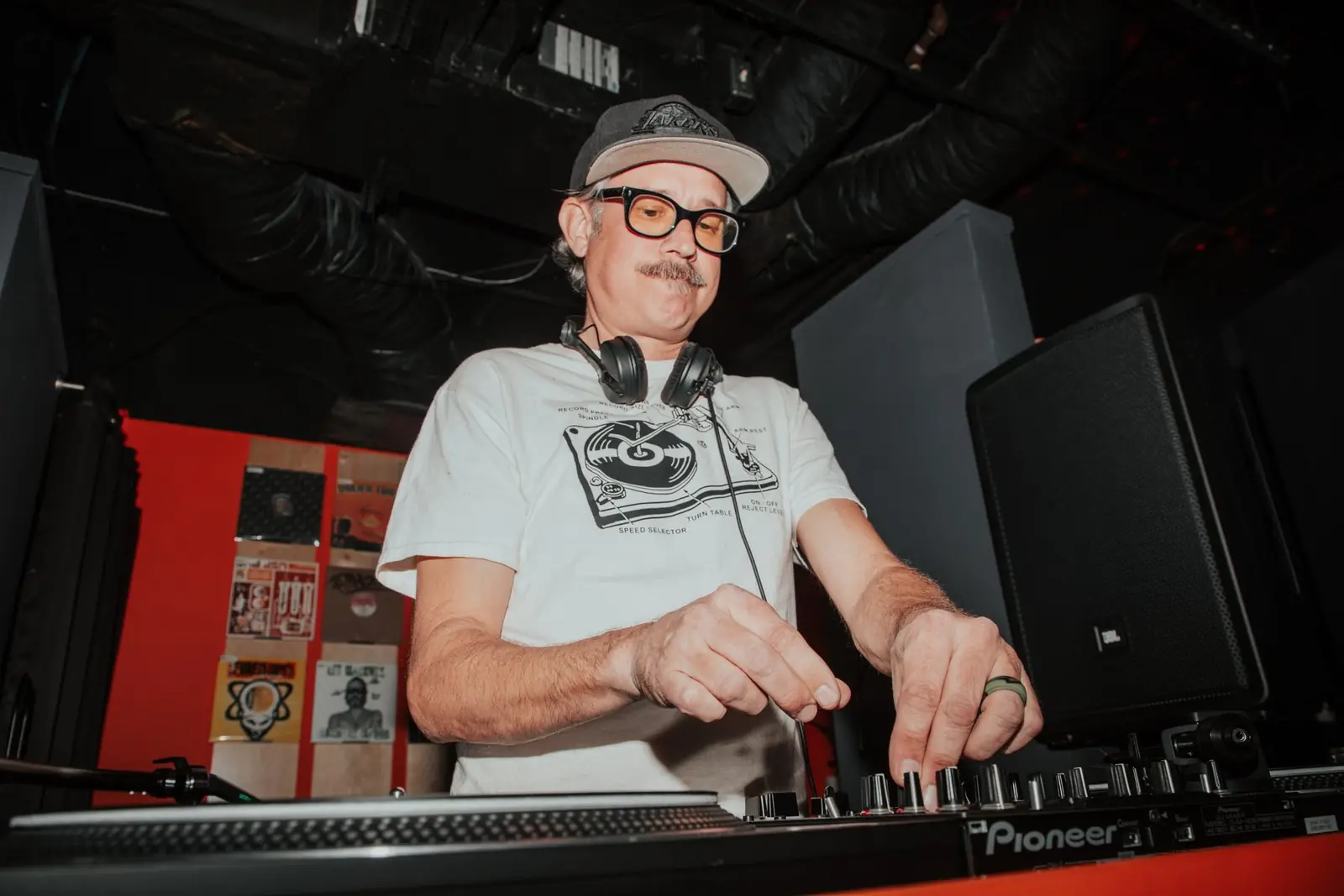 Veteran selector playing vinyl at Foot Work